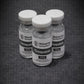 Three vials of Wolverine BioPeptides Tirzepatide on a dark background